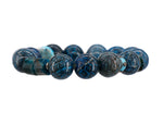 Load image into Gallery viewer, Blue snake skin patterned bracelet with turquoise bracelet
