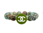 Load image into Gallery viewer, African turquoise with a repurposed designer button

