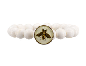 White conch bracelet with a white designer bee button