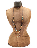 Load image into Gallery viewer, Olive wood, vintage African beads, horn, turquoise with a brass ring pendant
