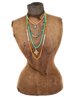 Load image into Gallery viewer, African vinyl and trade bead necklace with a brass pendant
