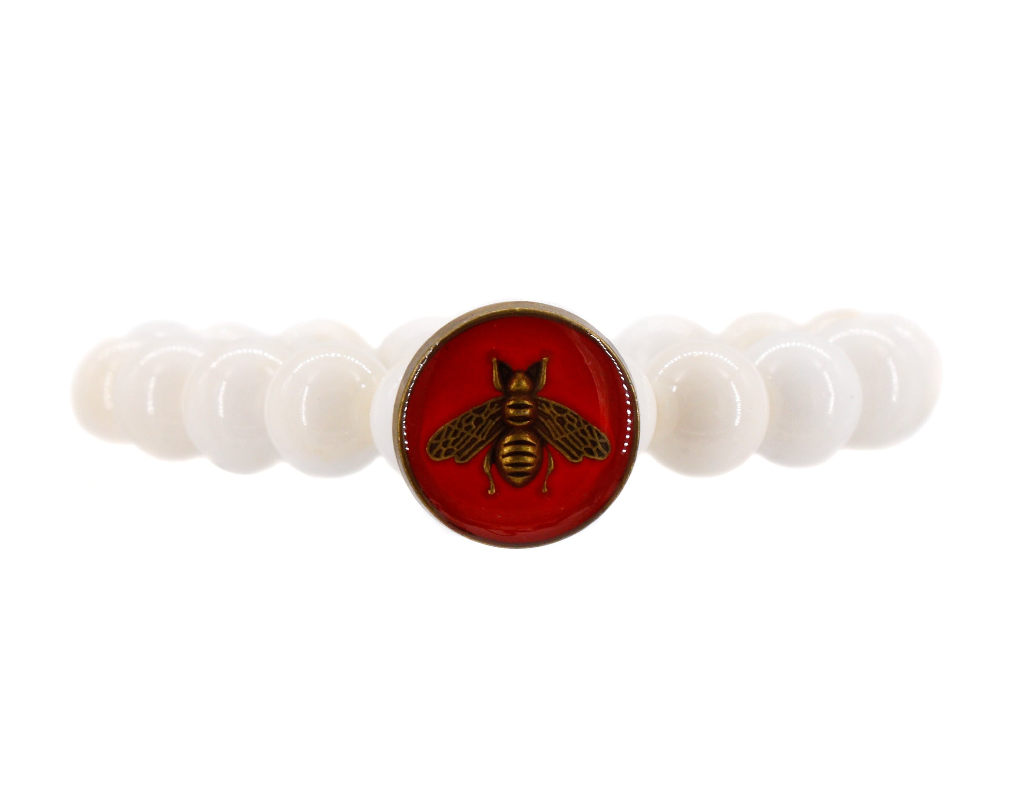 White conch bracelet with a repurposed designer red bee button