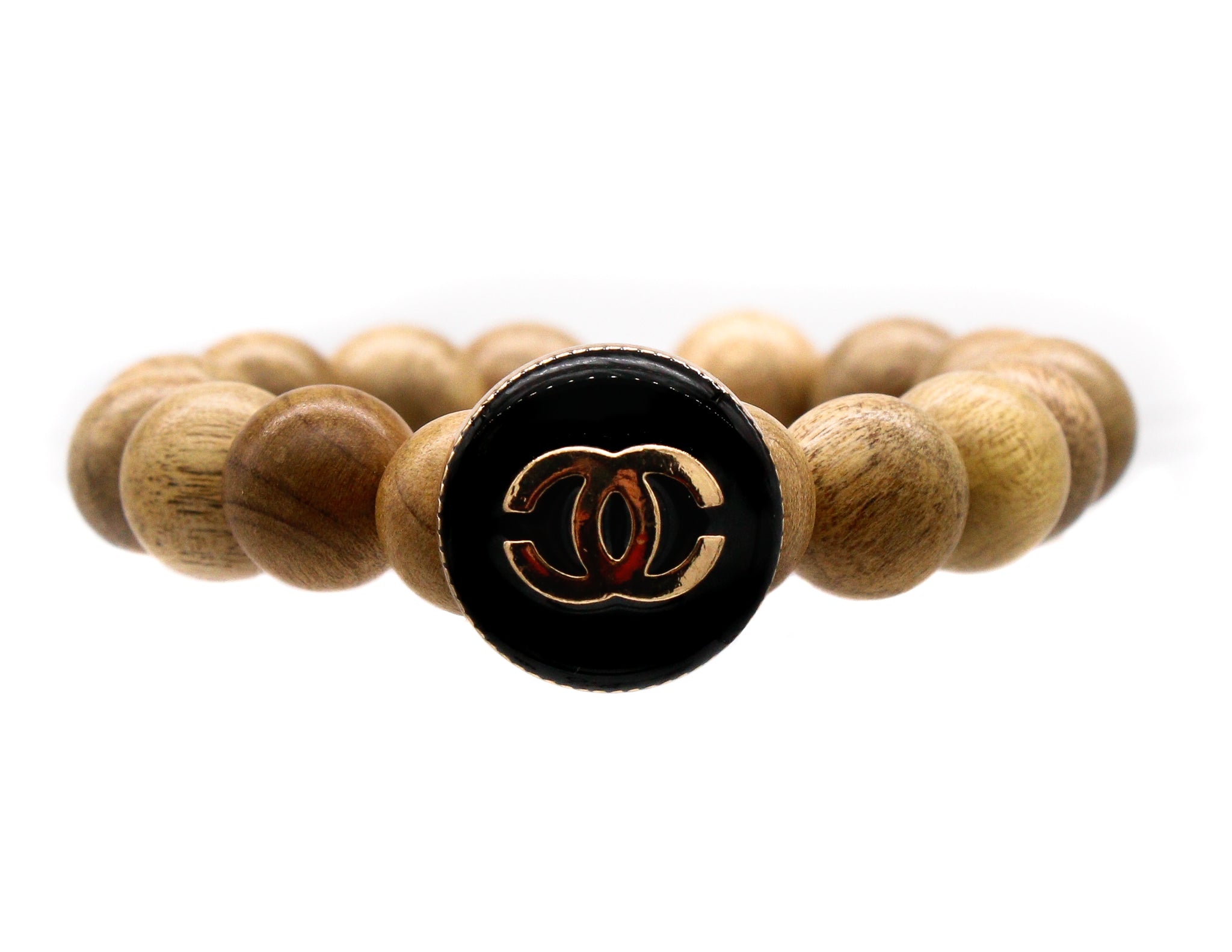 Sandalwood bracelet with a repurposed designer button