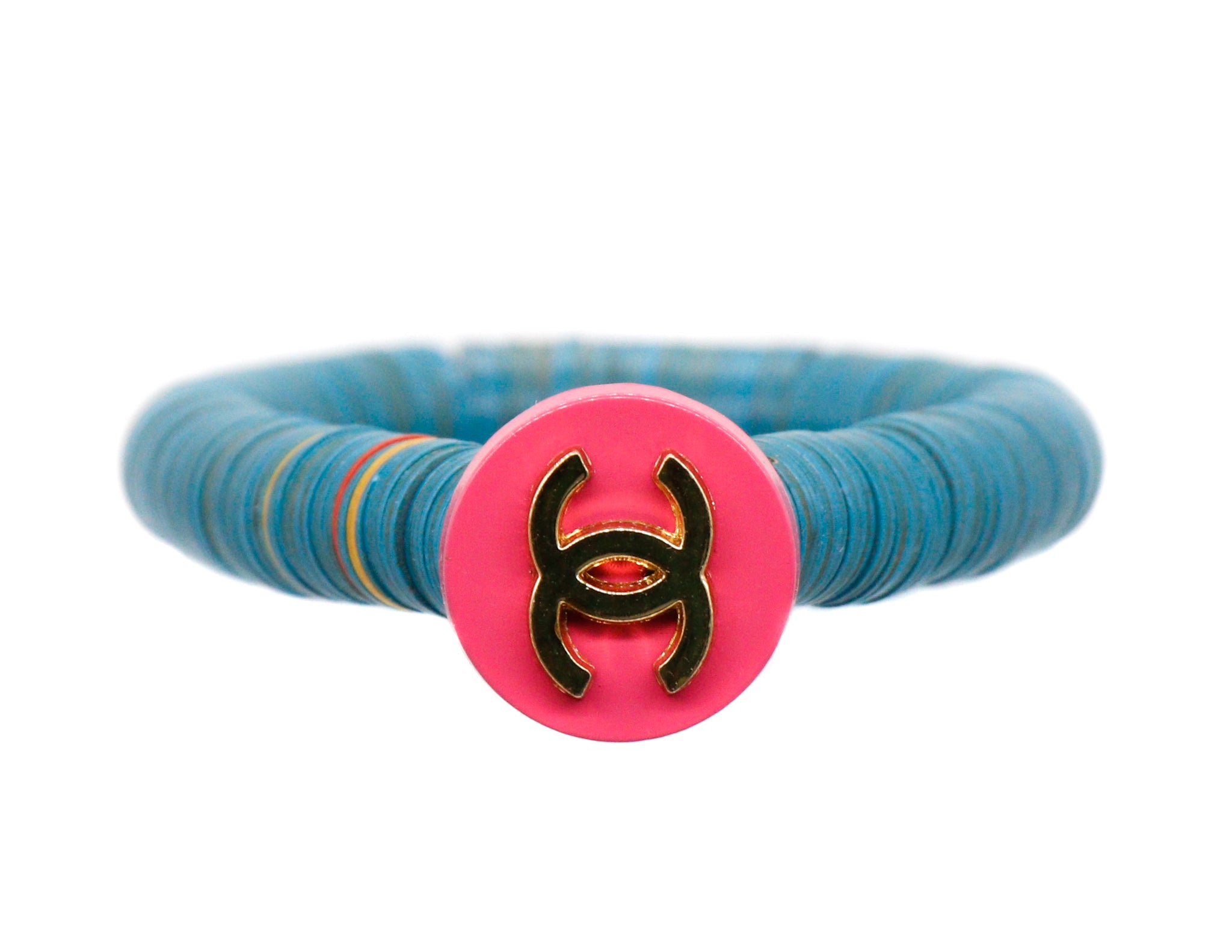 African vinyl bracelet with a repurposed pink designer button