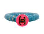 Load image into Gallery viewer, African vinyl bracelet with a repurposed pink designer button
