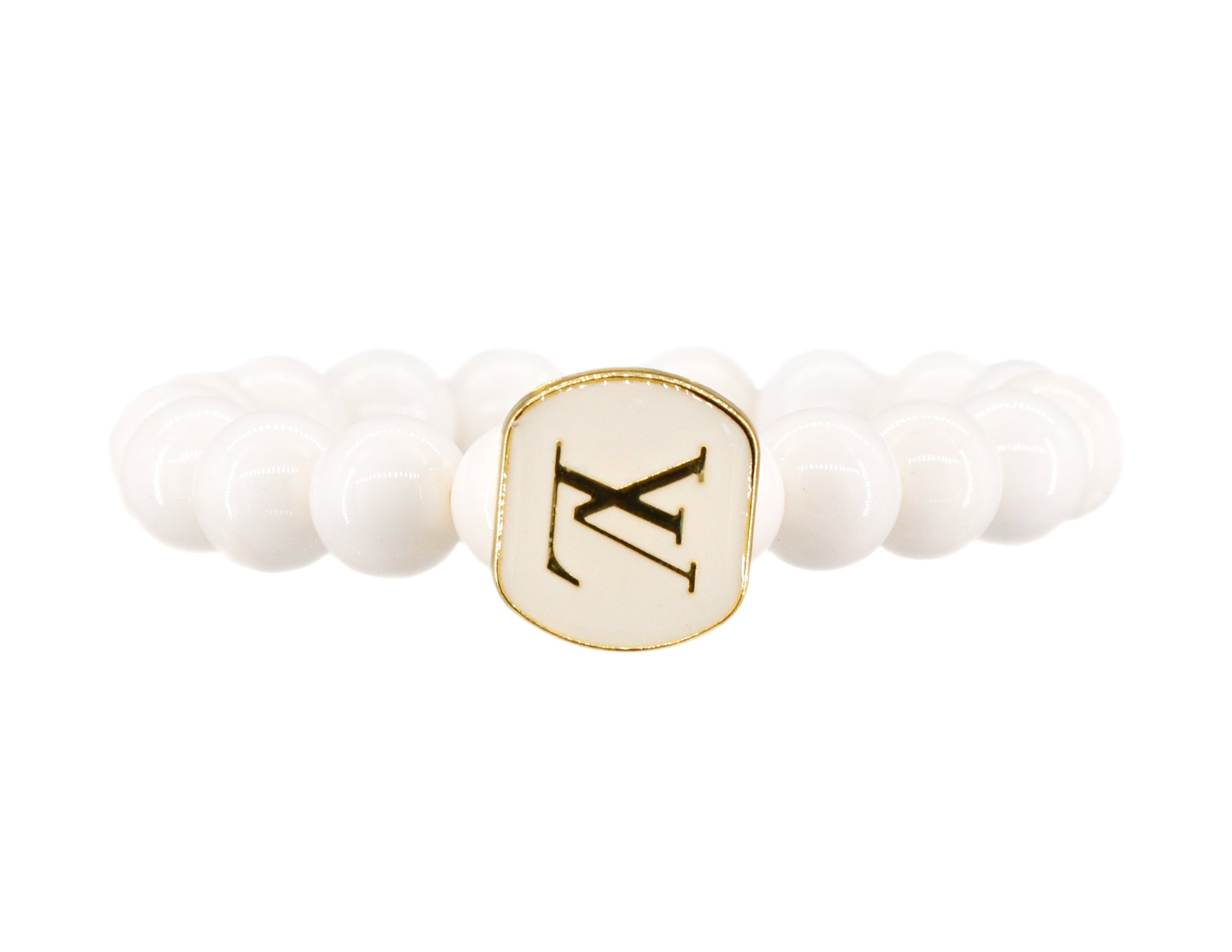 White conch beads with a repurposed designer button bracelet