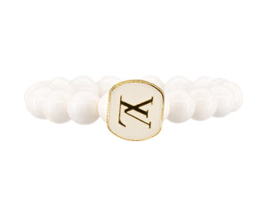 White conch beads with a repurposed designer button bracelet
